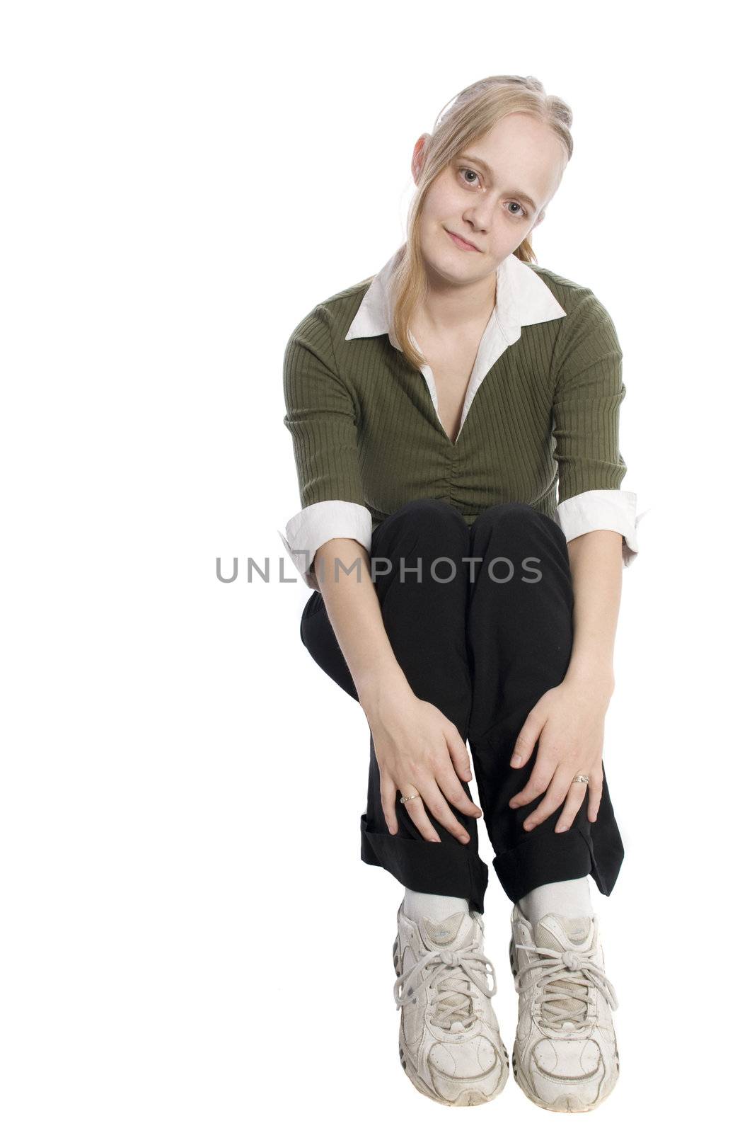 young woman on whit in a sitting pose