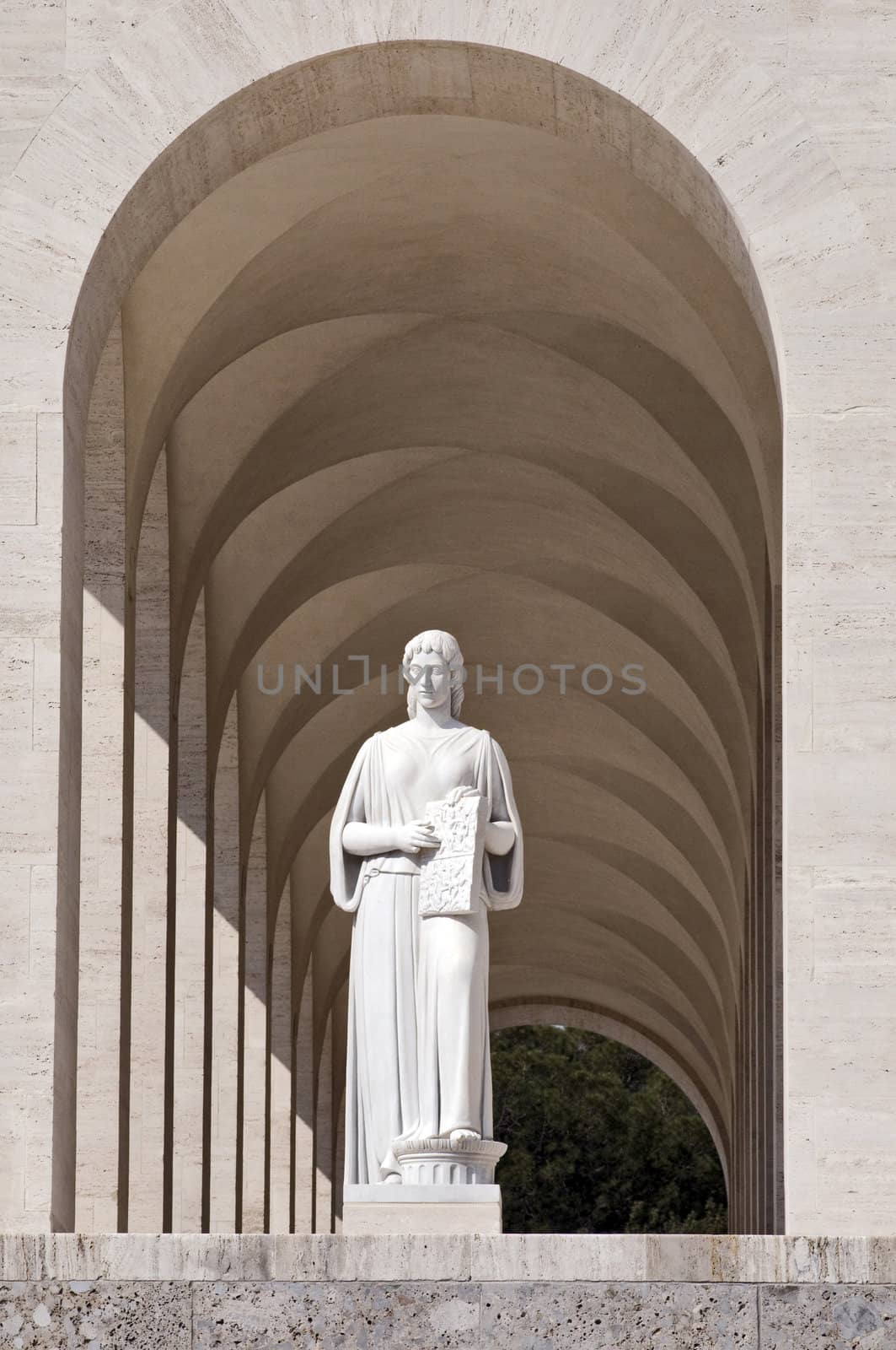 Squared colosseum detail with marble statue - Eur zone - Rome Italy.