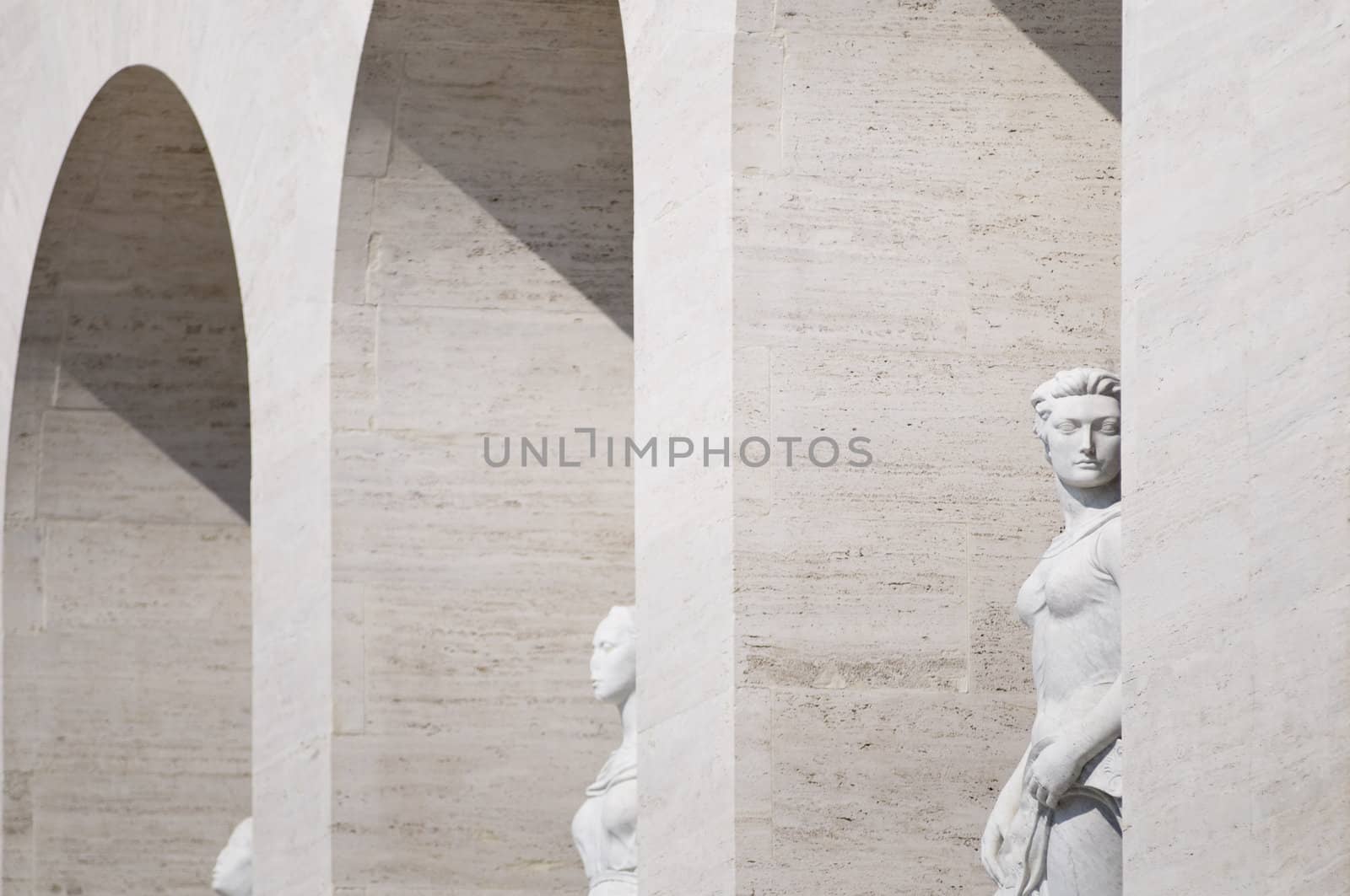 Squared colosseum detail with marble statue - Eur zone - Rome Italy.