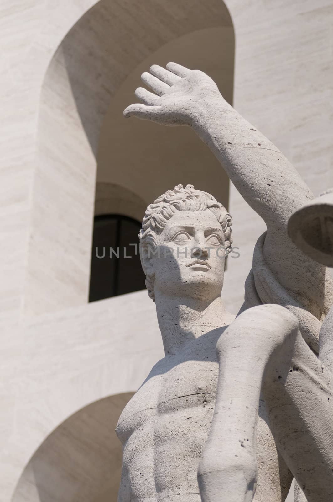 Squared colosseum detail with marble statue - Eur zone - Rome Italy.