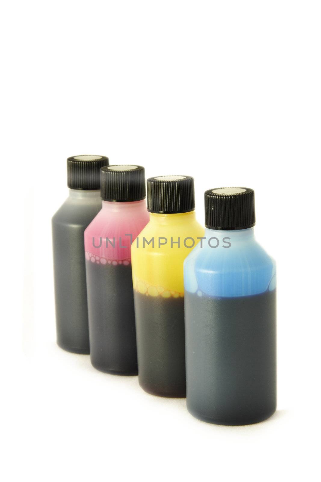 four plastic bottles with different coloured ink in each