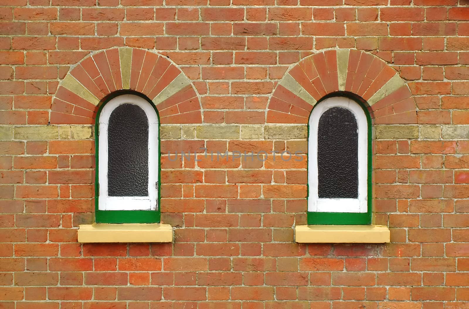 architectural background of bricks and arched windows