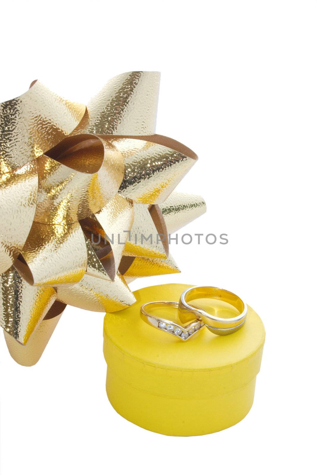two rings on top of their gift box and ribbon isolated