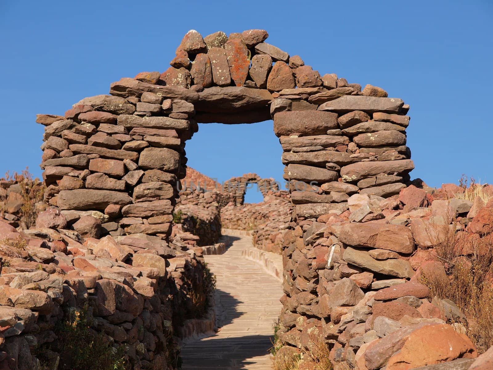 Old arch build out of undressed stones, Amantani Island, Titicaca Lake
