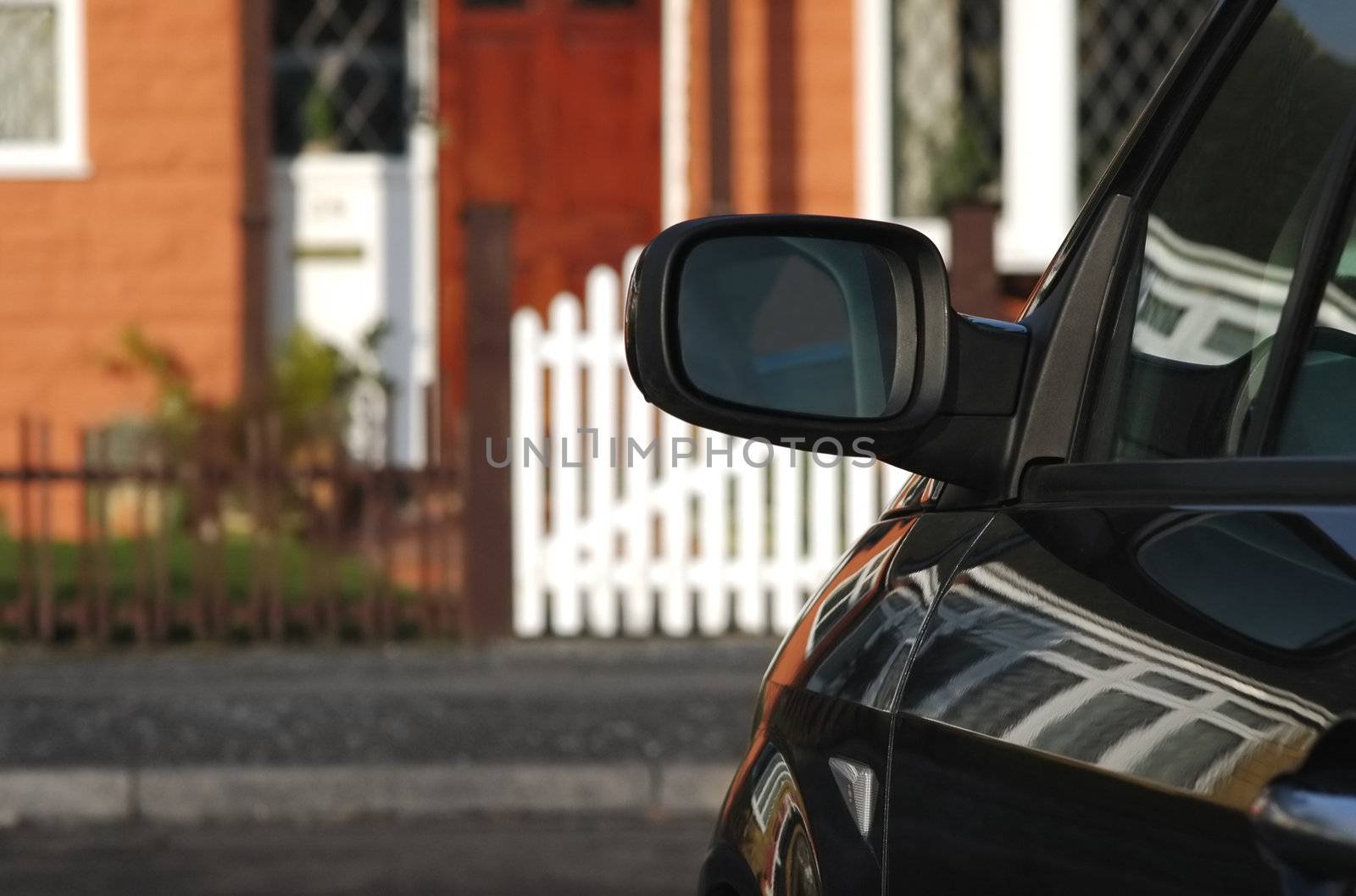 closeup of a parked vehicle outside a home