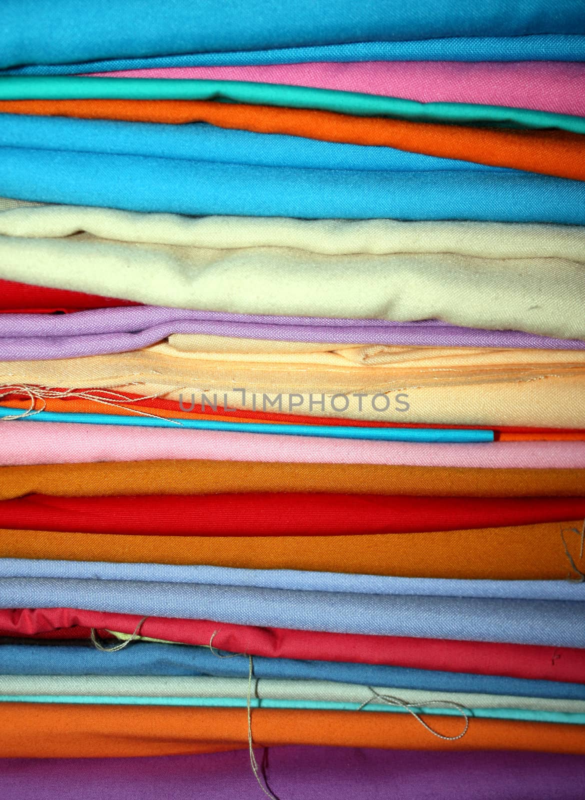 A stack of colorful fabrics.