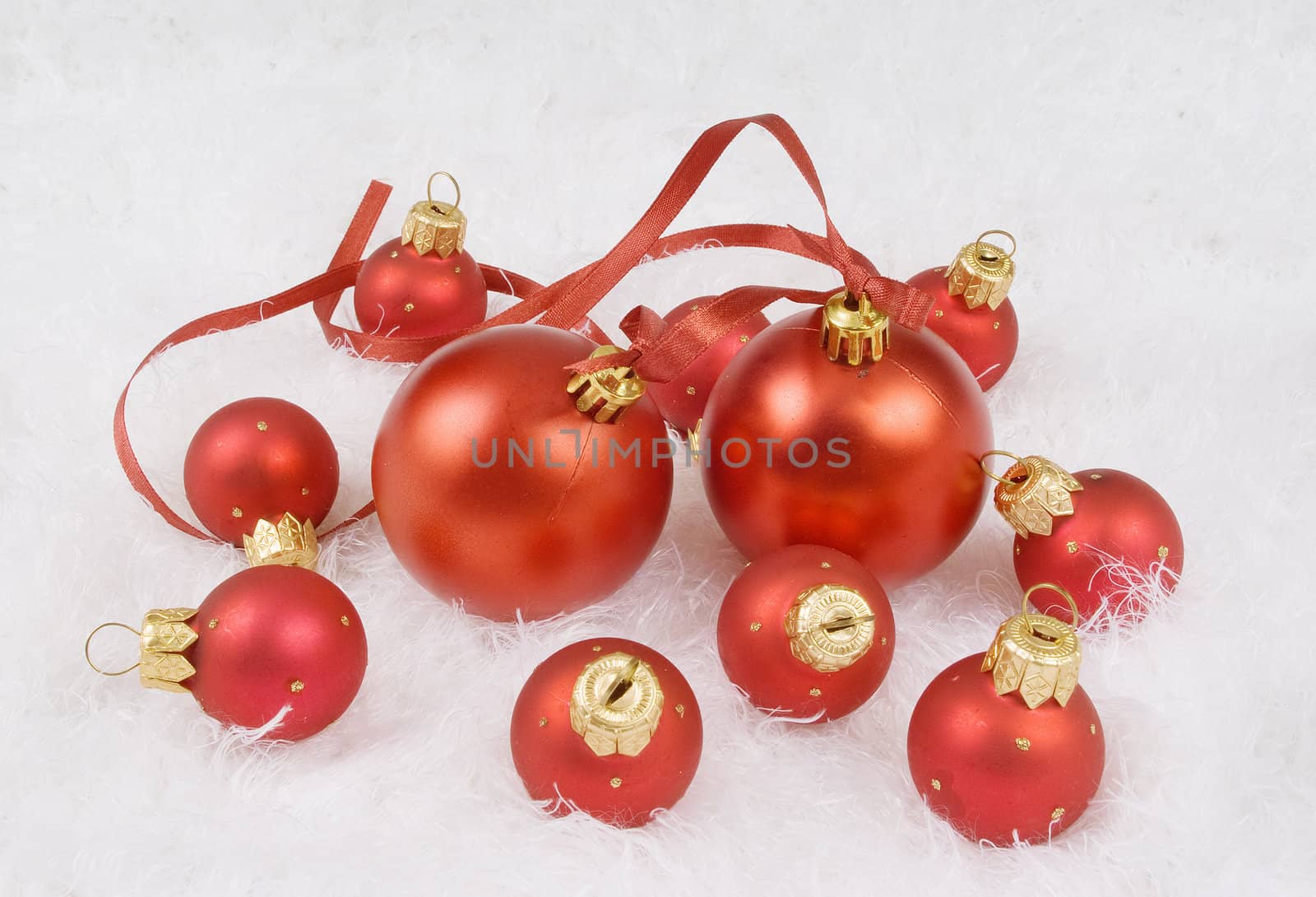 Christmas red spheres on the white fur