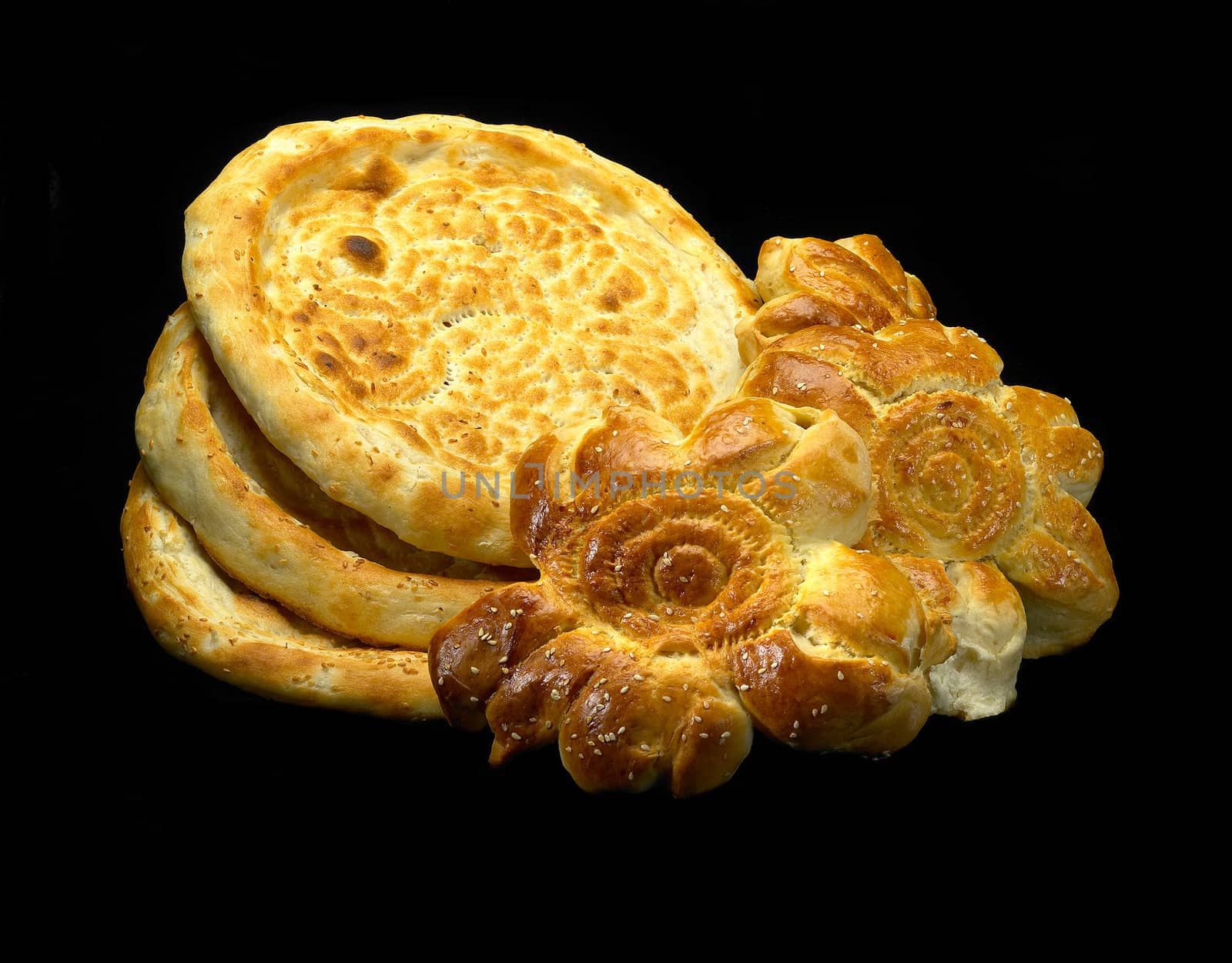 original fresh uzbek bread isolated over black background
