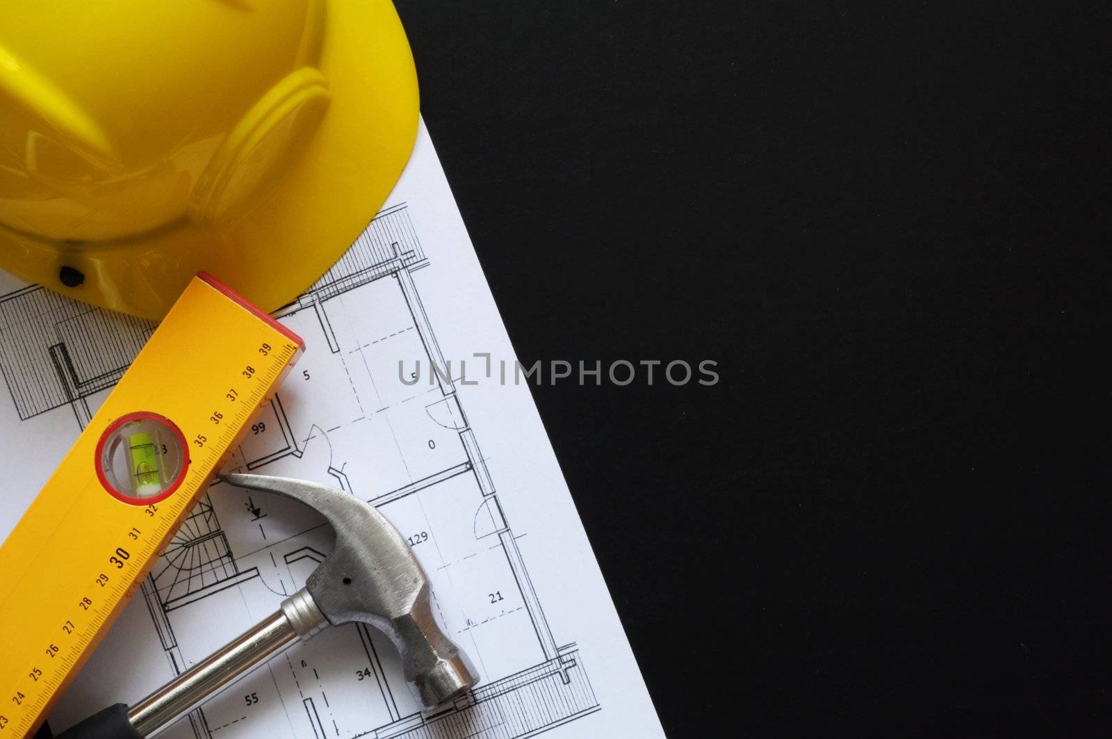 real estate concept with hard hat blueprints tools and copyspace