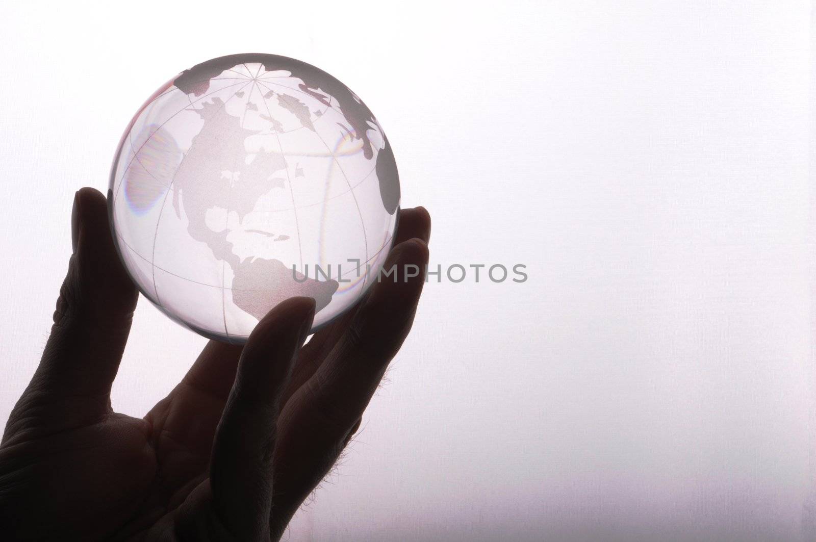 globe in hand isolated on white showing eco environment or business concept