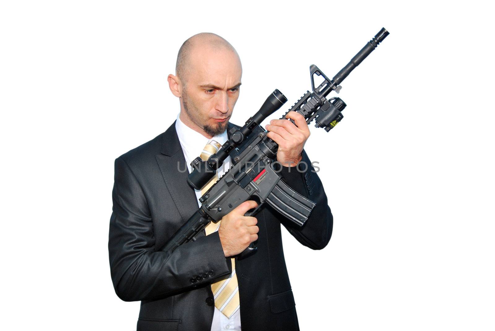 Businessman bodyguard isolated on a white background with a big gun