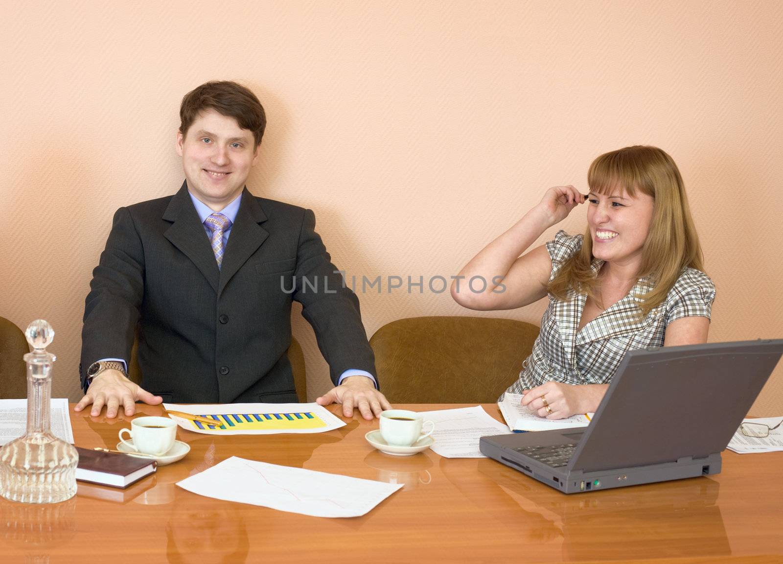 Business people sits at the wooden table