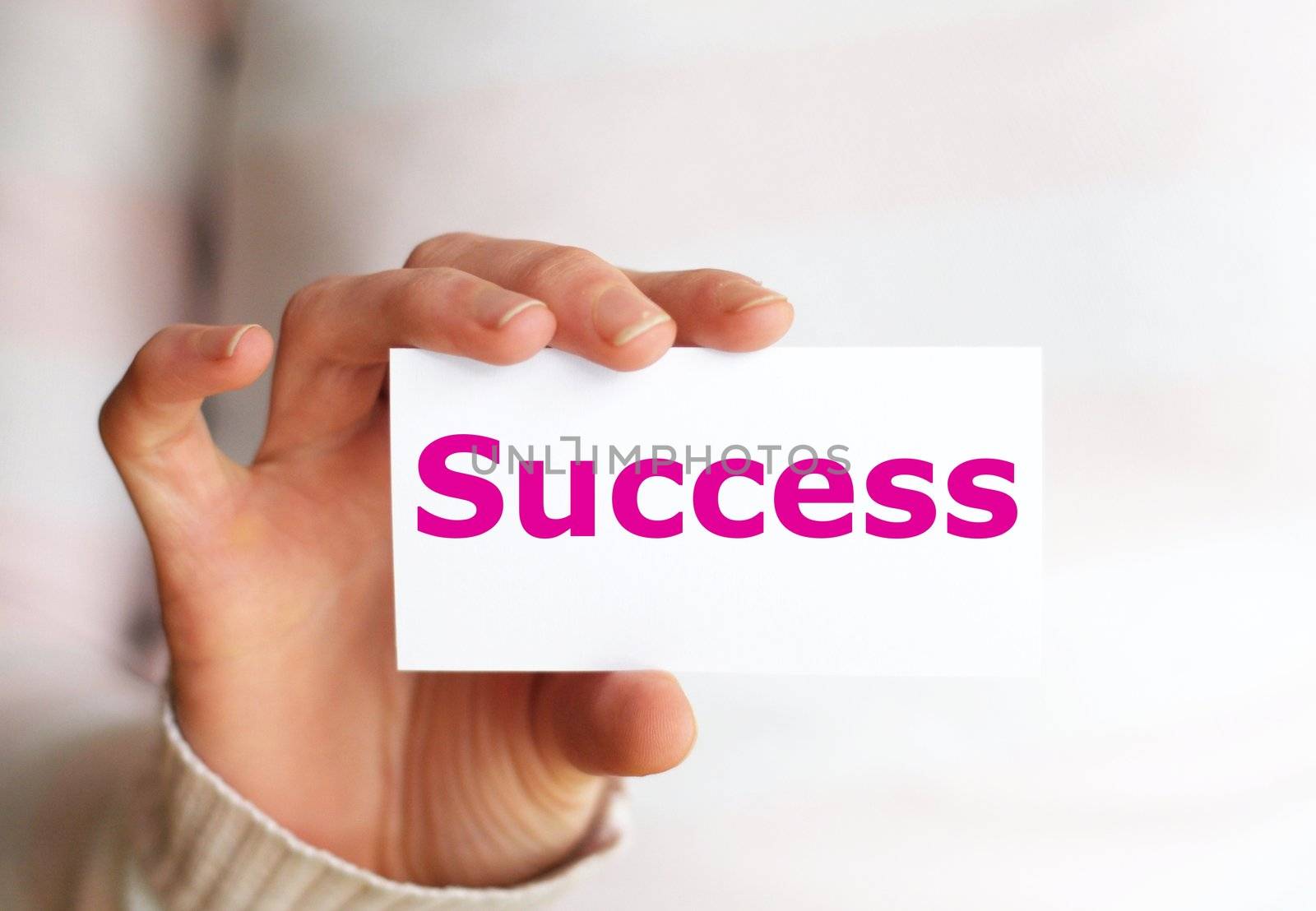 business success concept with hand word and paper