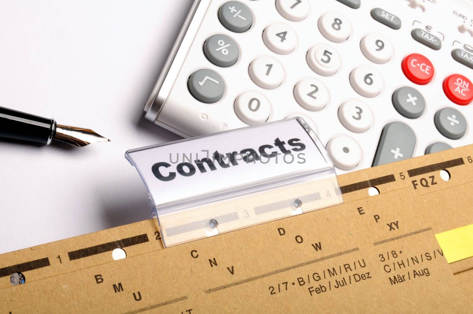 contract word on business folder showing trade or financial concept