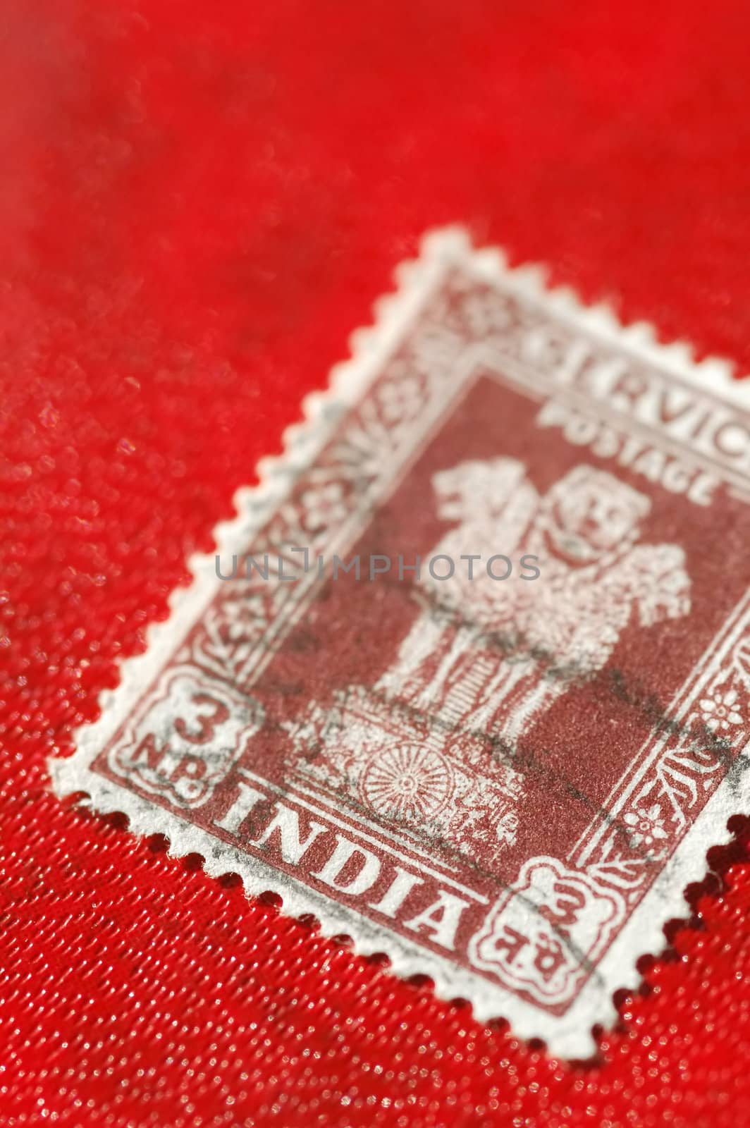 vintage Indian postage stamp on a red background