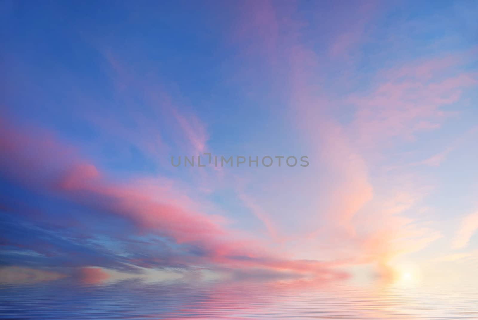 Sunset with purple clouds and blue sky reflecting in water.