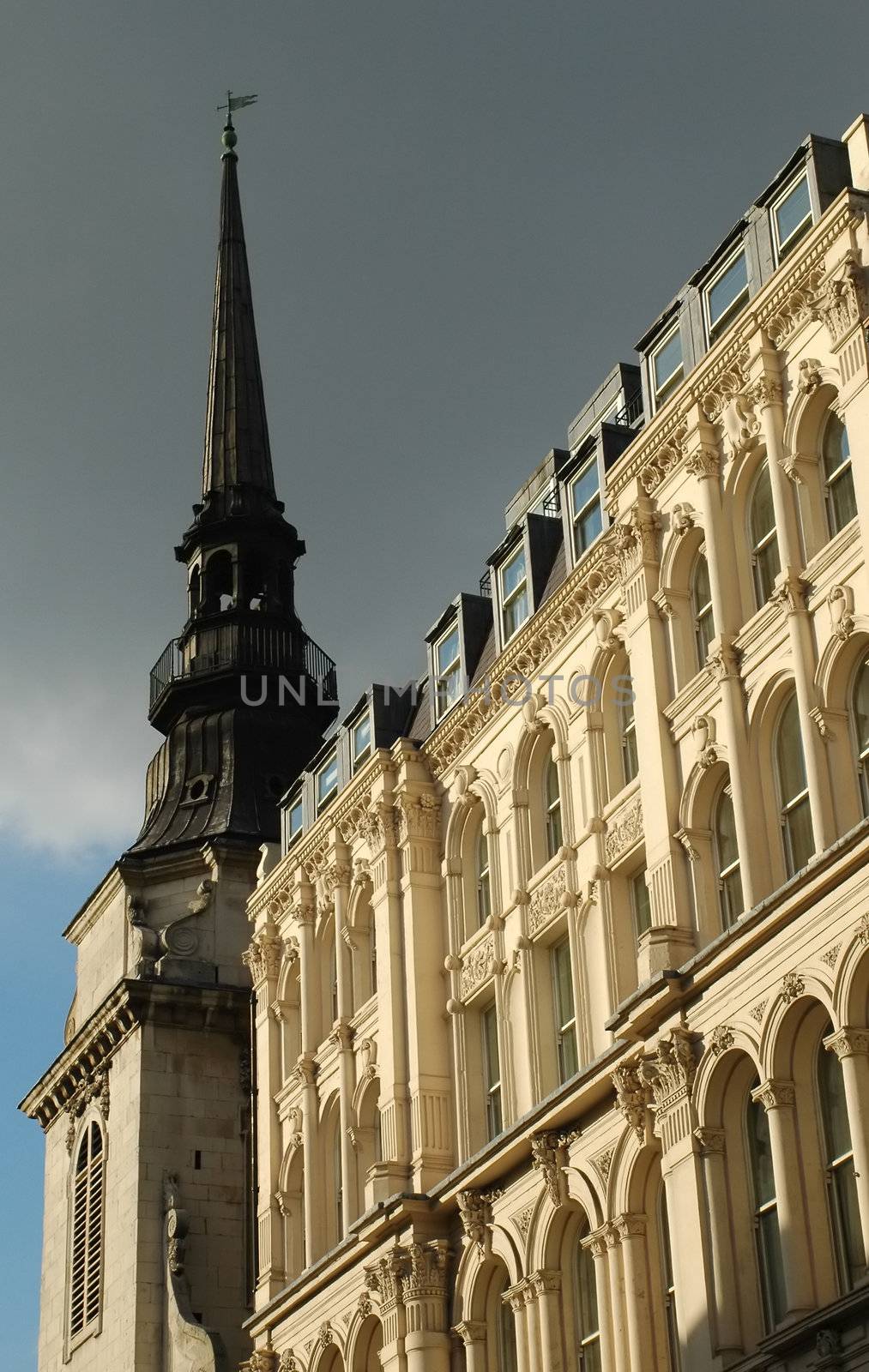 dark clouds over a gothic church spire in london