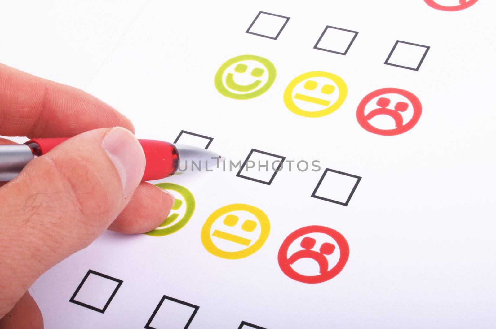 hand pen and checkbox or tickbox with smilie