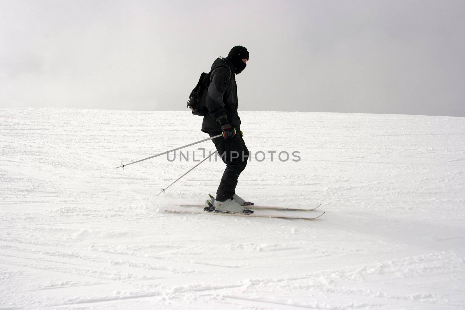 Skier sliding down the slope