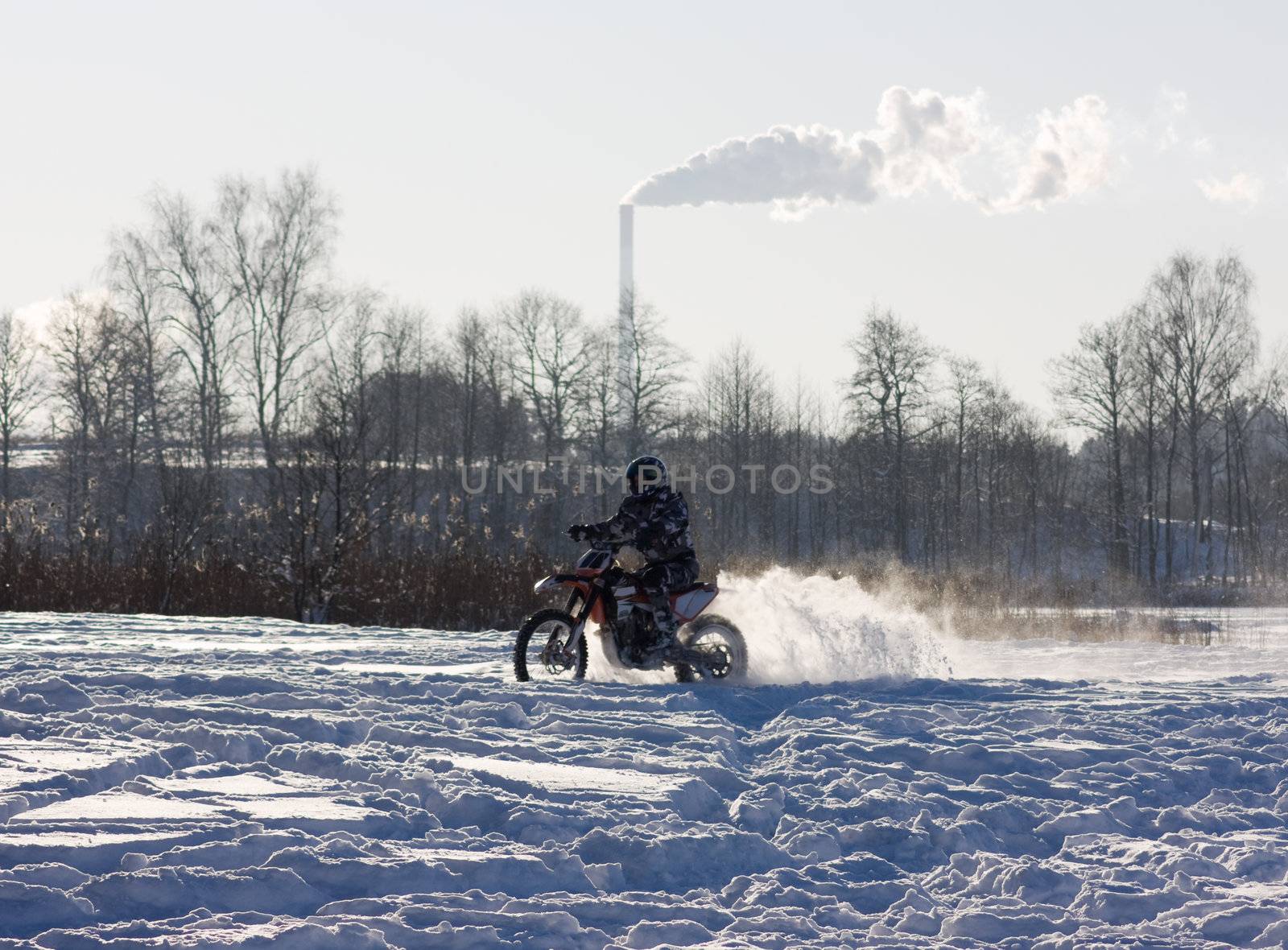 race on a motorcycle in the winter