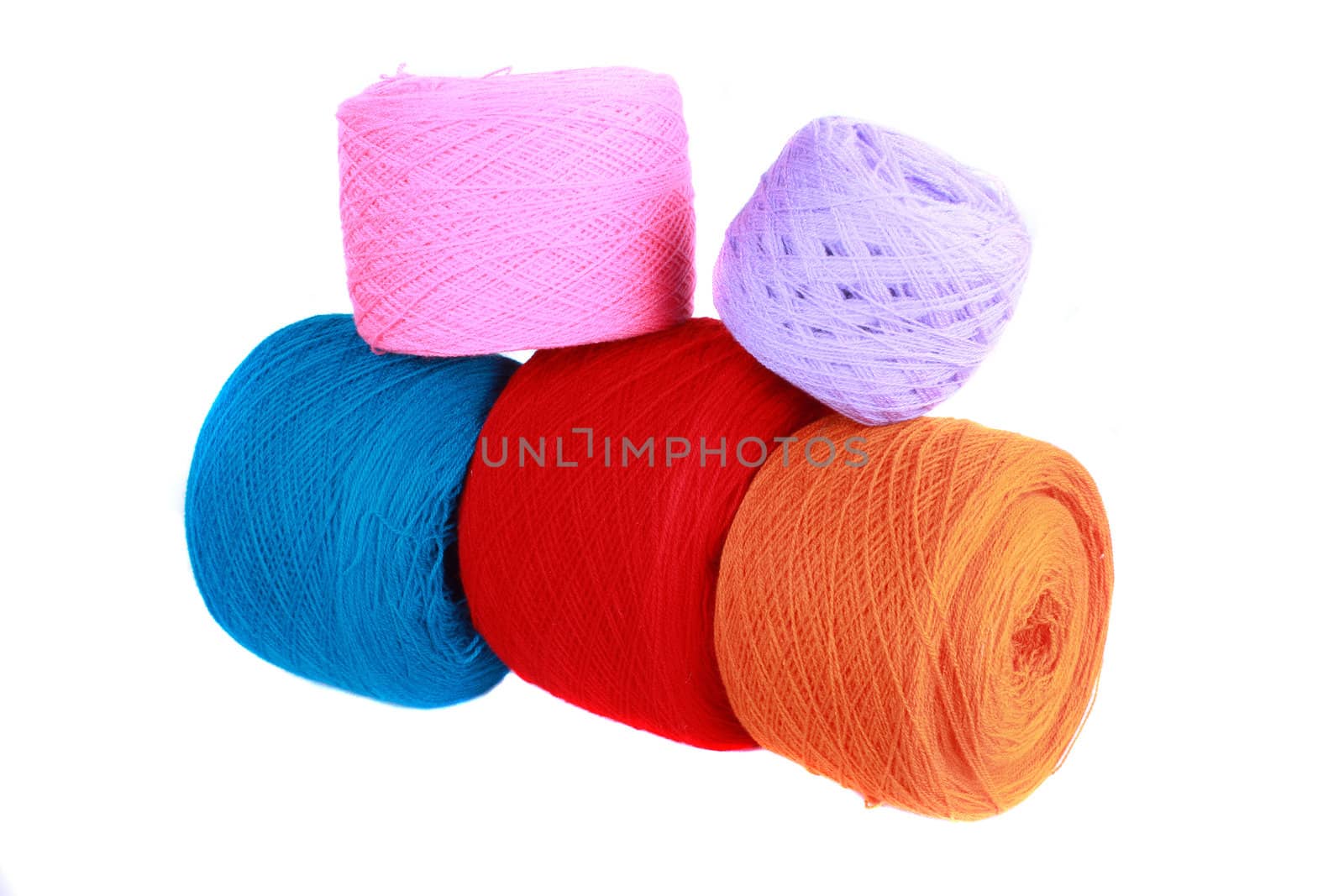 Woolen balls in different bright colors, on white background