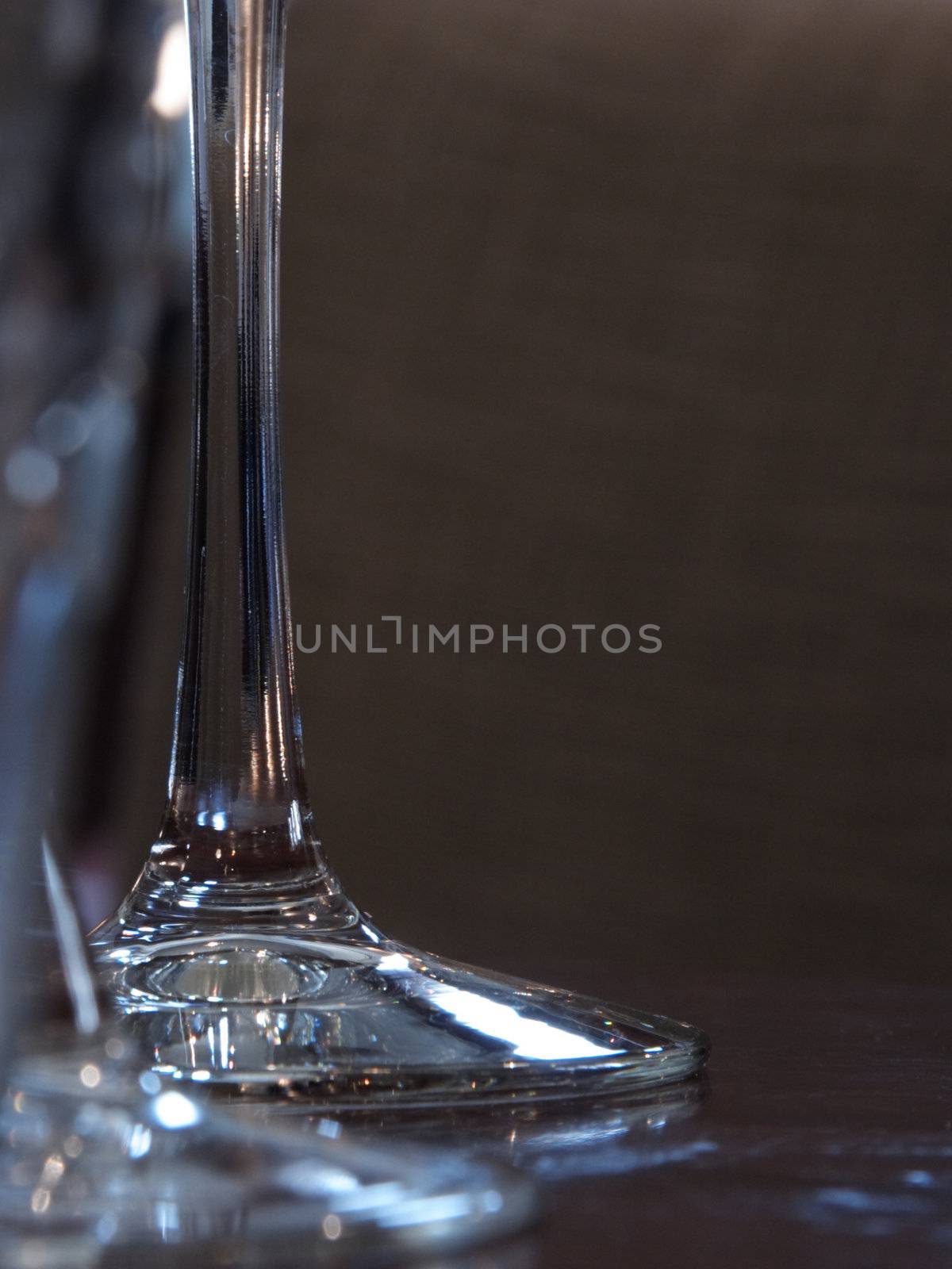 tall glass stems on a wooden table