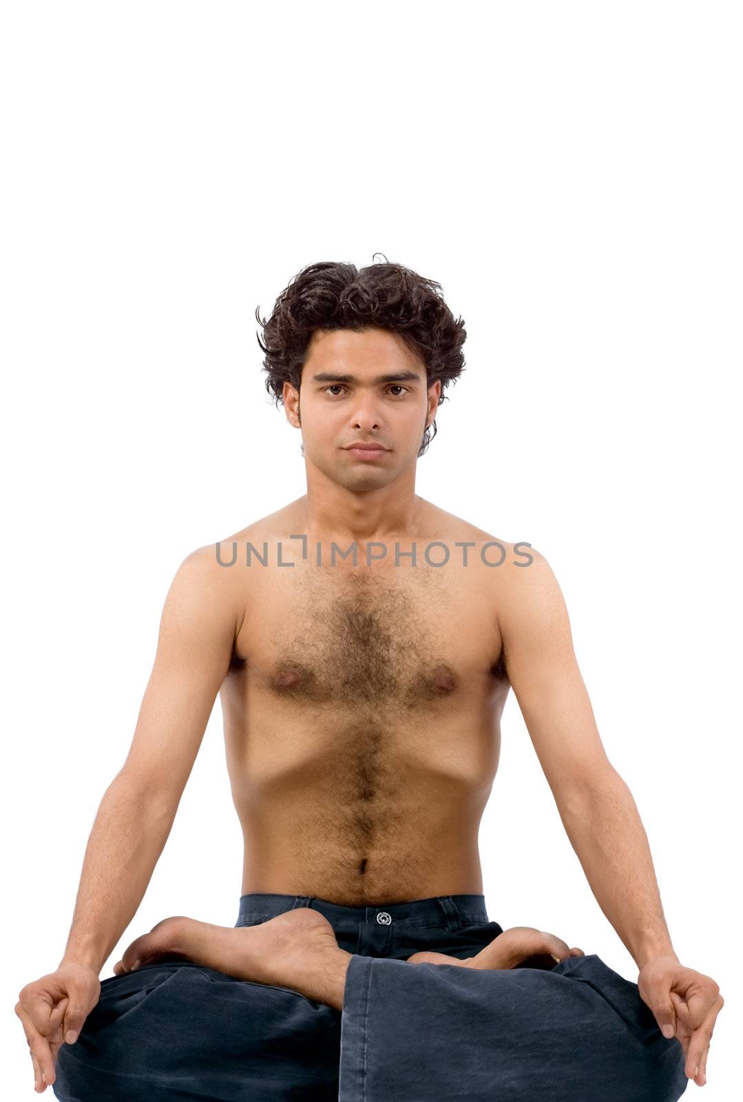 Young handsome man doing yoga in white background
