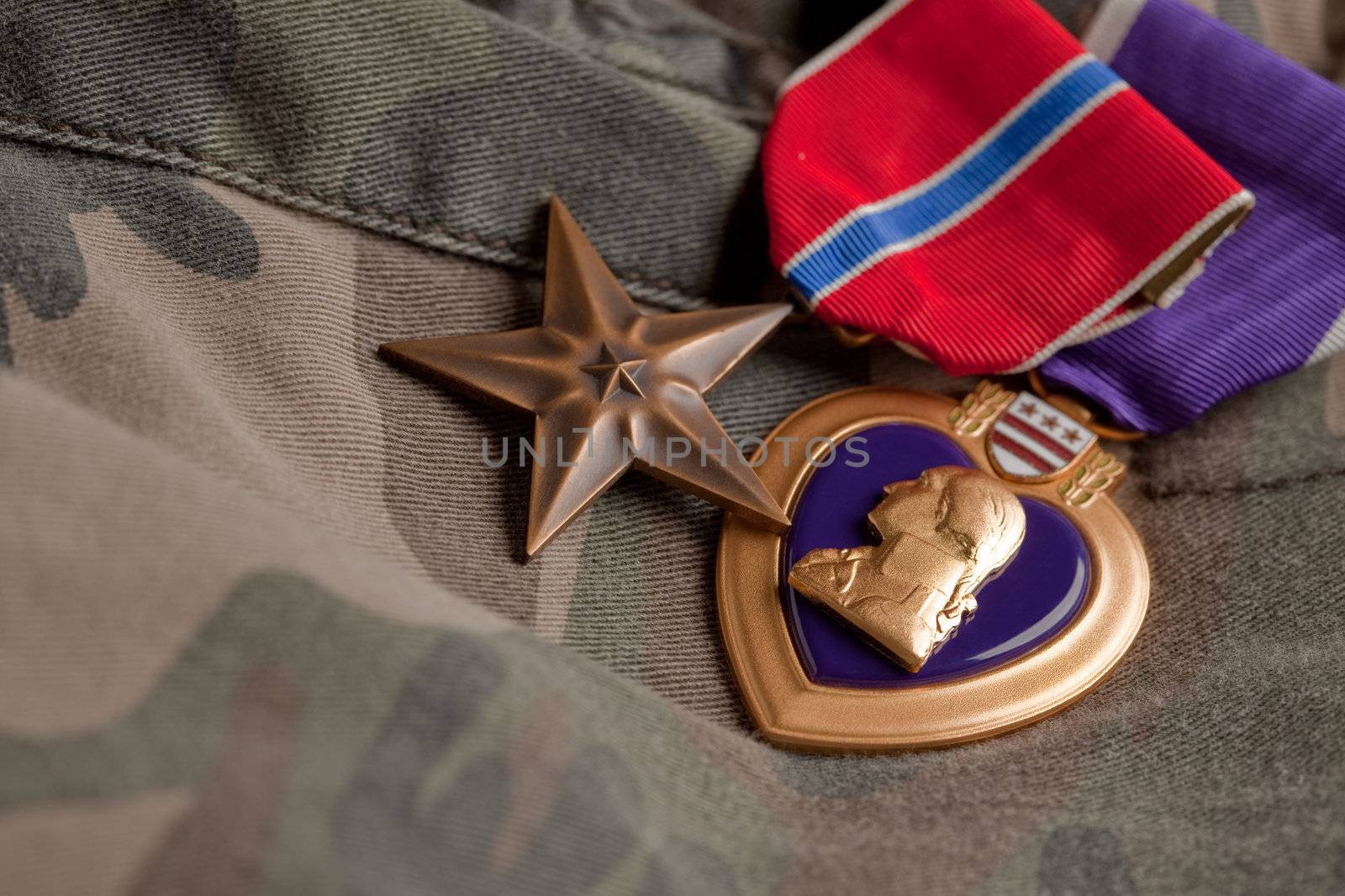 Bronze and Purple Heart Medals on Camouflage Material
