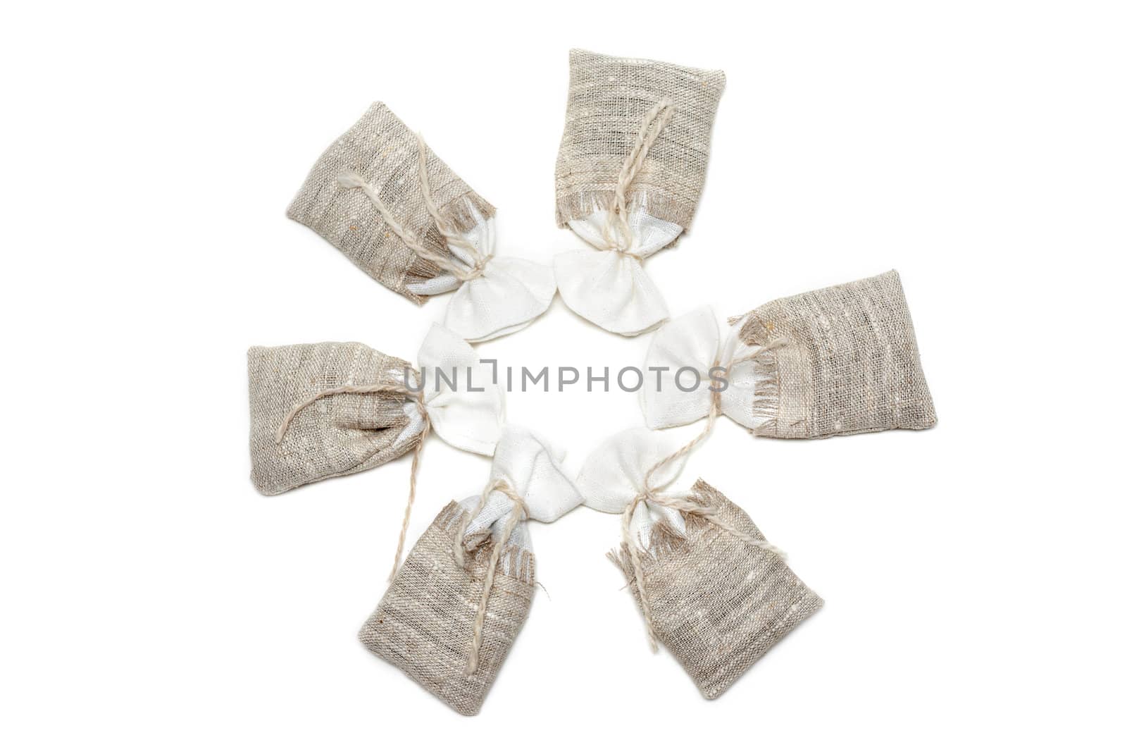 Sac pervaded spice and tied rope on white background