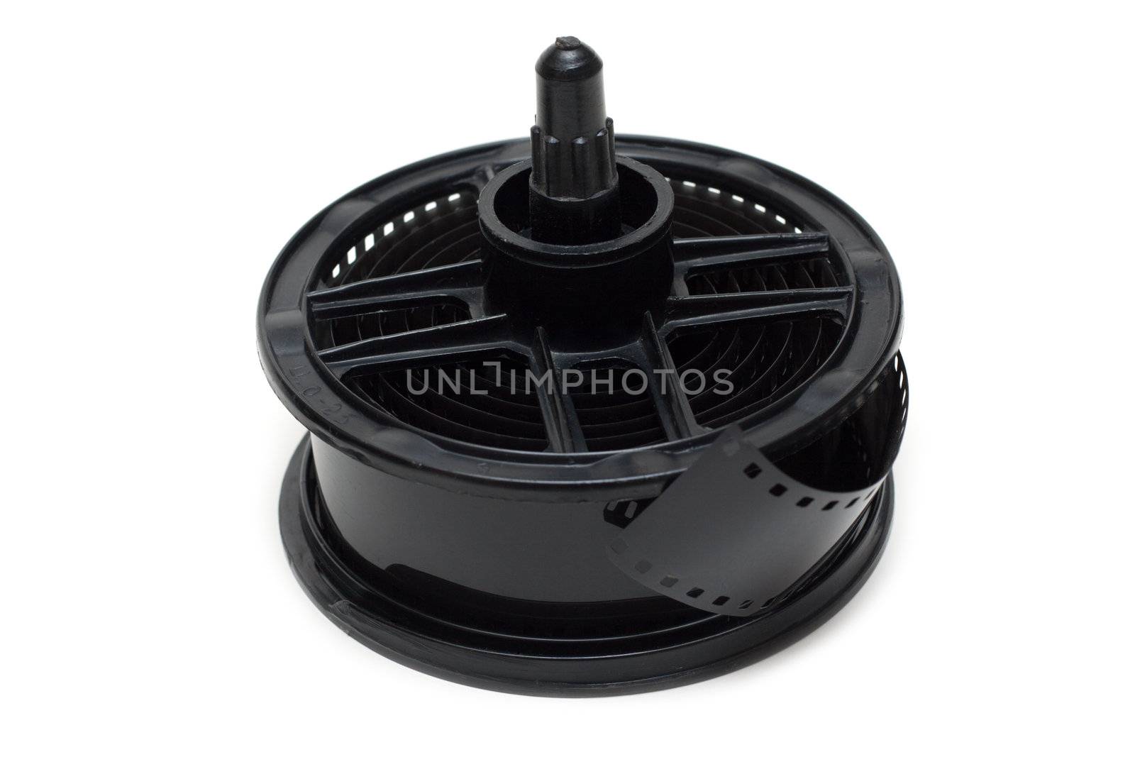 Spool for proappearance with negative monochrome film on white background