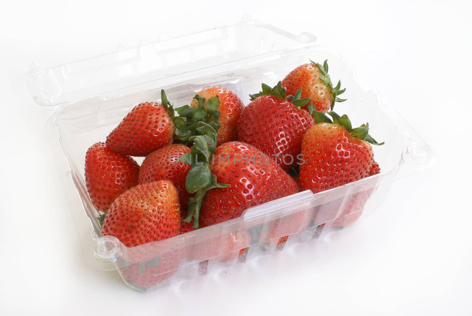 A basket of ripe strawberries on white background.