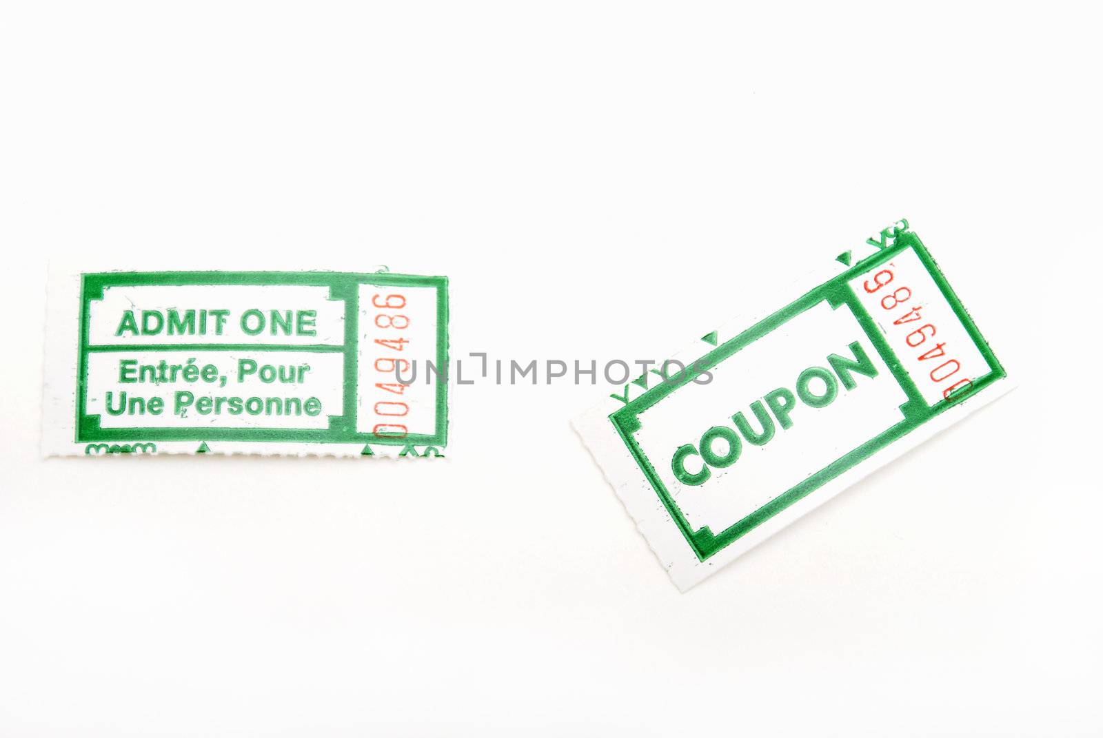 A couple of green ticket stubs on white background.