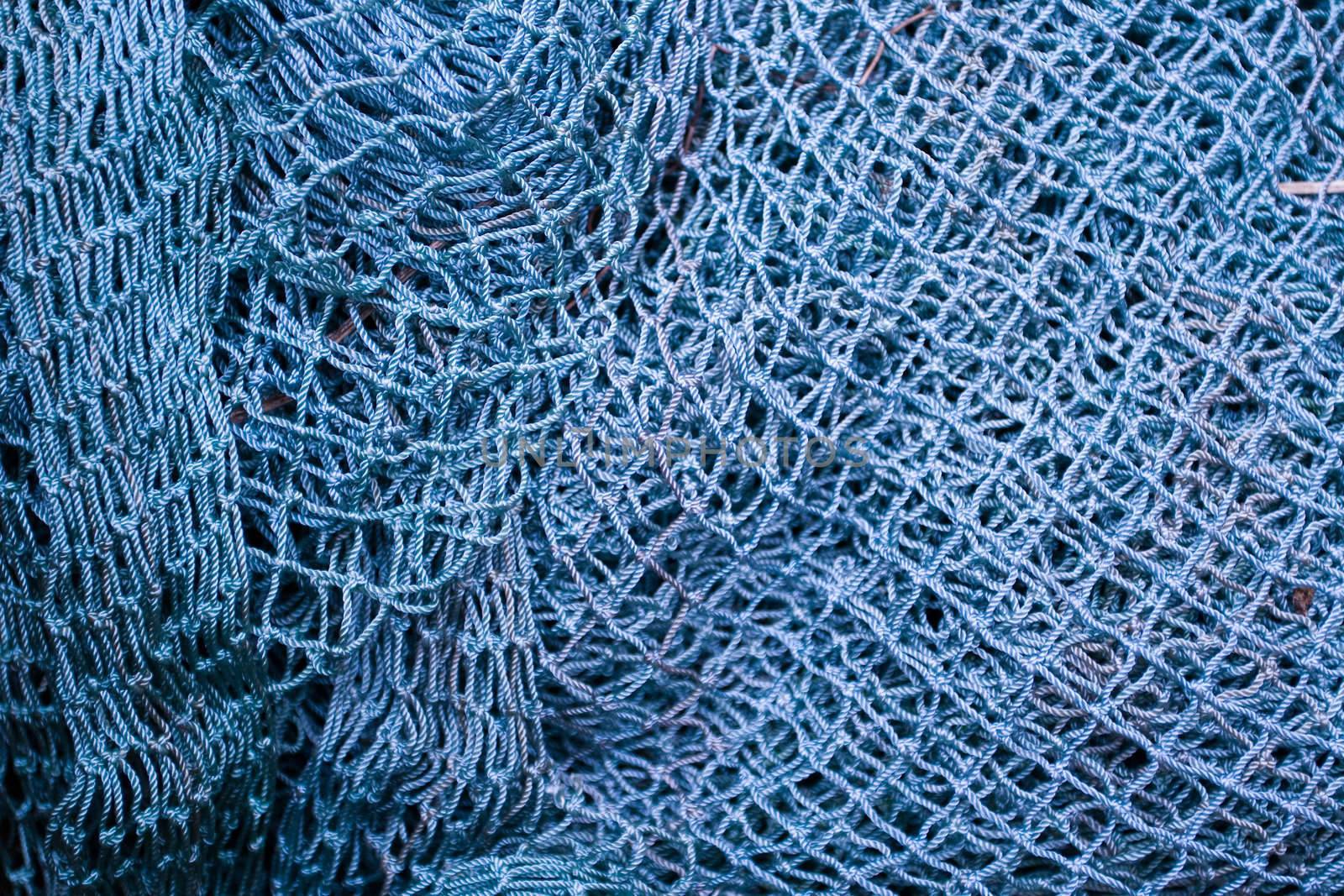 Close up of blue industrial fishing net background