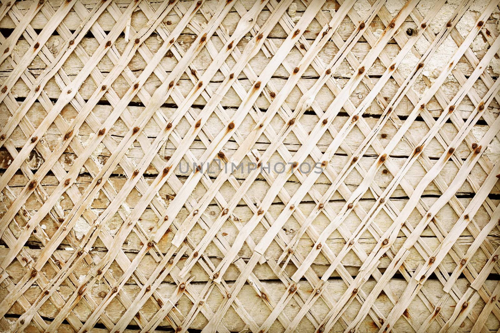 Old wooden wall deprived of plaster - background