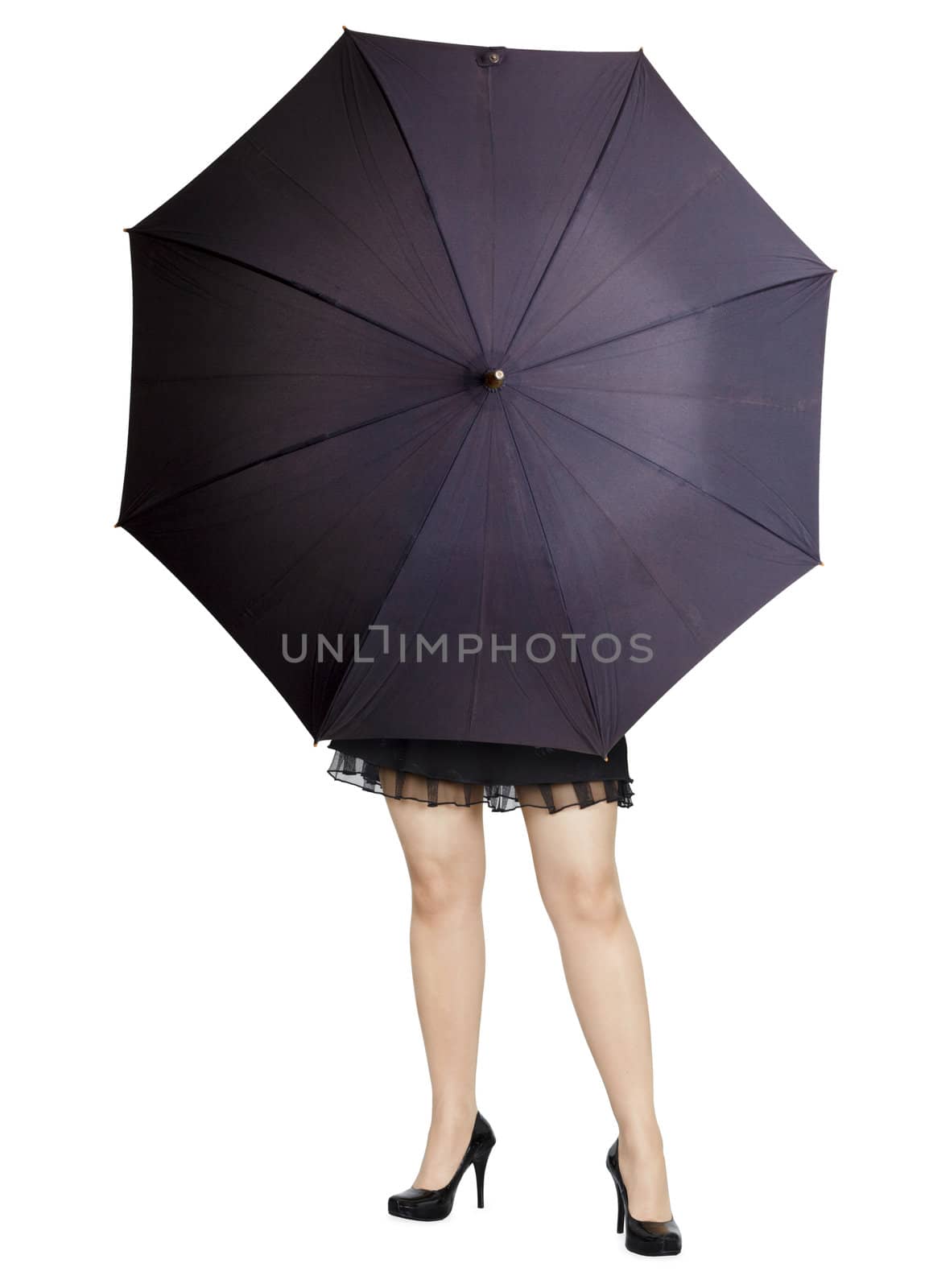 Beautiful stranger hiding behind a large umbrella isolated on white background