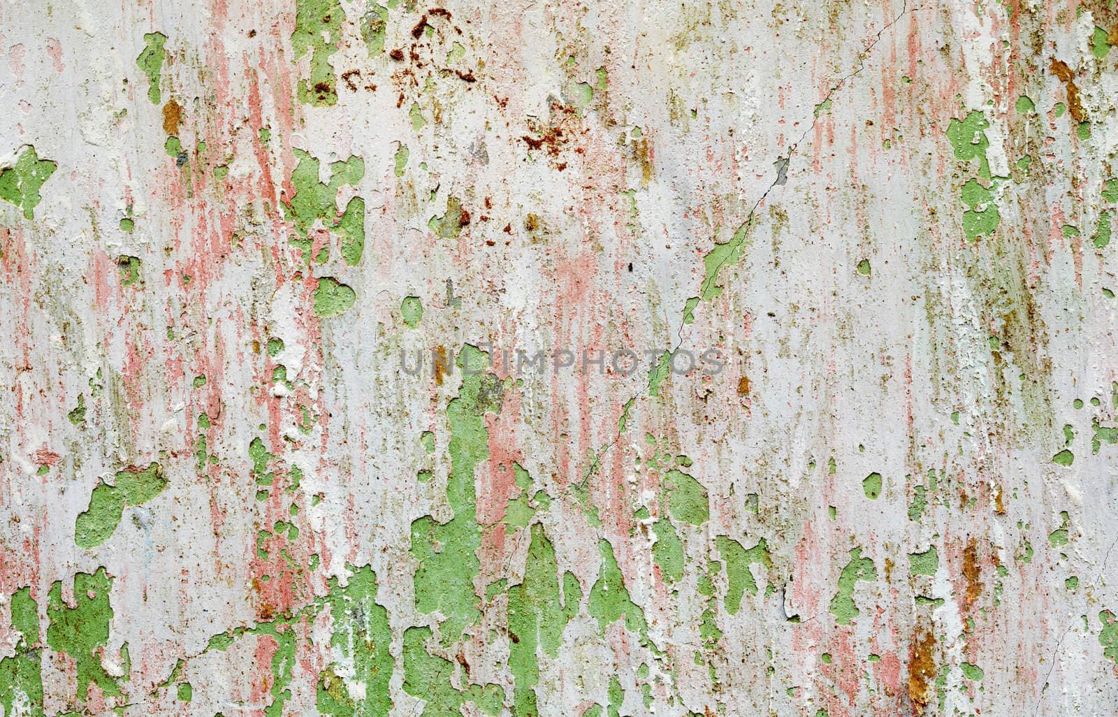 Background - a wall of the destroyed building with the damaged paint