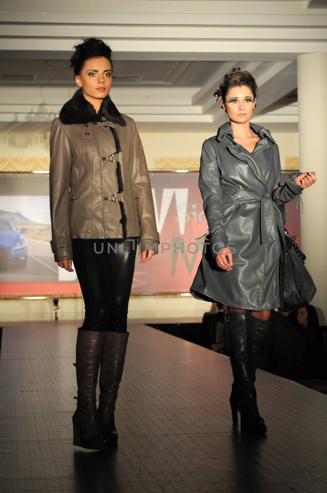 SIEDLCE, POLAND - NOVEMBER 19: models showcasing designs from Ochnik leather collection walk the catwalk at the Siedlce Fashion Evening on November 19, 2010 in Siedlce, Poland