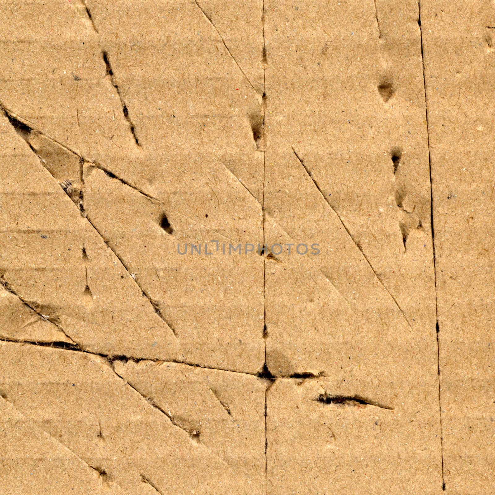 Brown grunge corrugated cardboard sheet useful as a background