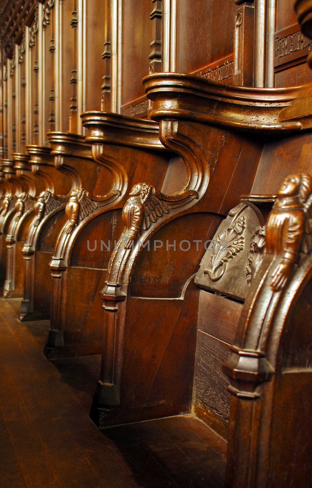 ornate elizabethan carved wooden choir stalls
