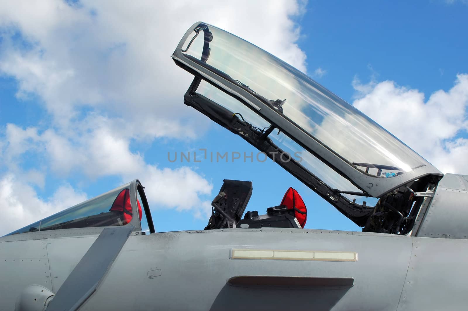 open canopy of an unmarked military jet