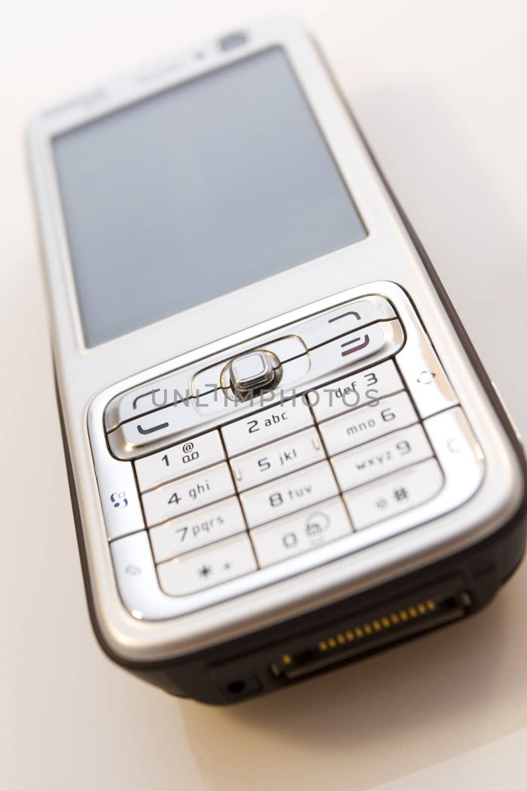 Silver mobile phone isolated on white