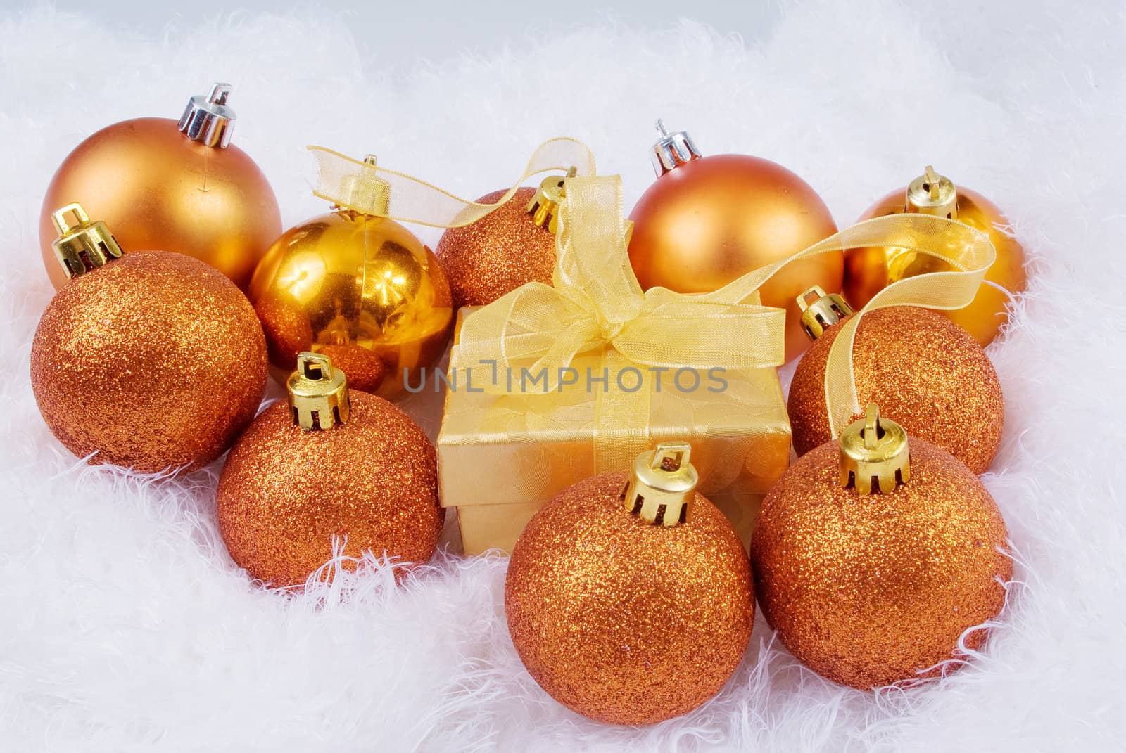 Christmas brightly spheres on the white fur