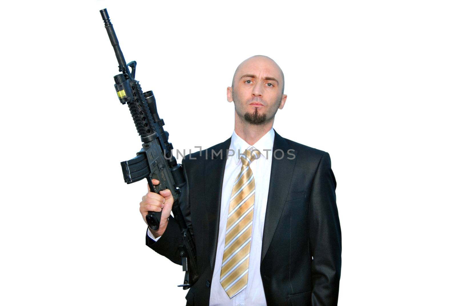 Businessman bodyguard isolated on a white background with a big gun