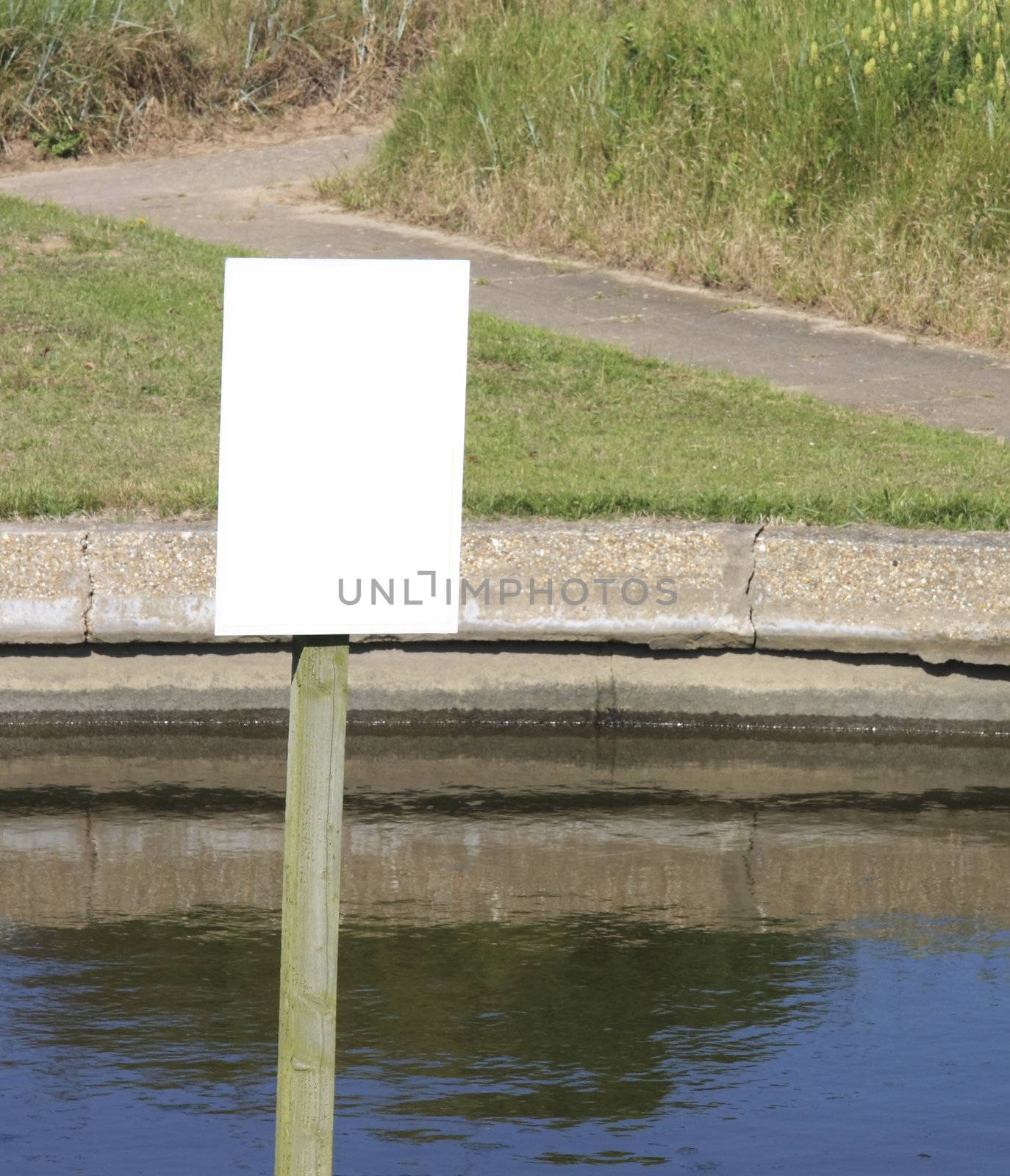 white signpost against a watery background