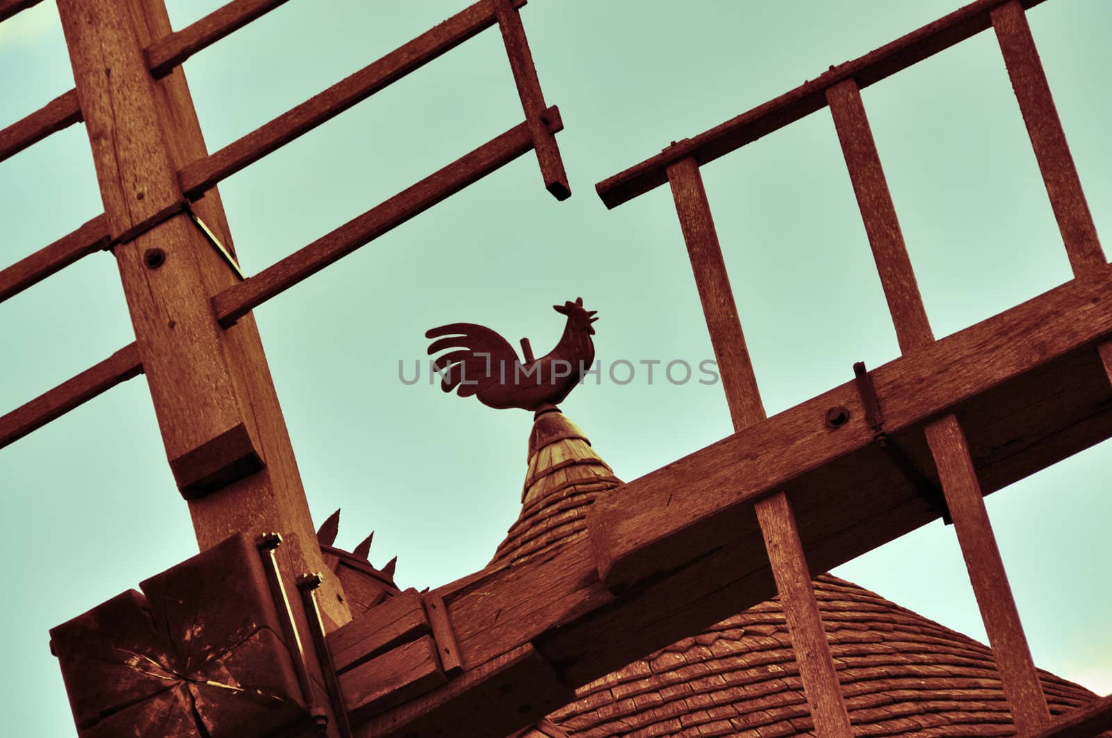 Weathercock of vintage wind mill in Brittany, France