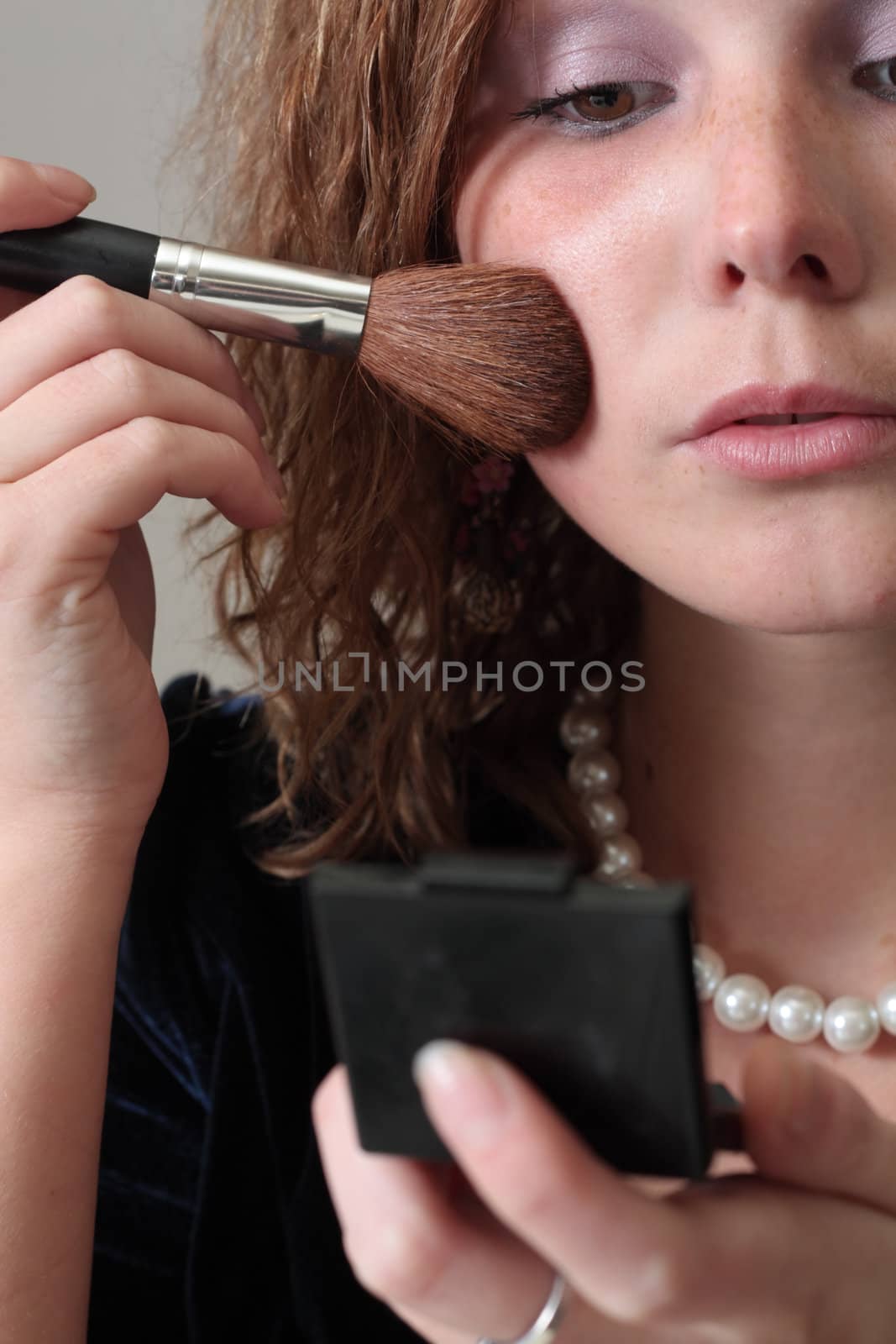 girl applying make-up