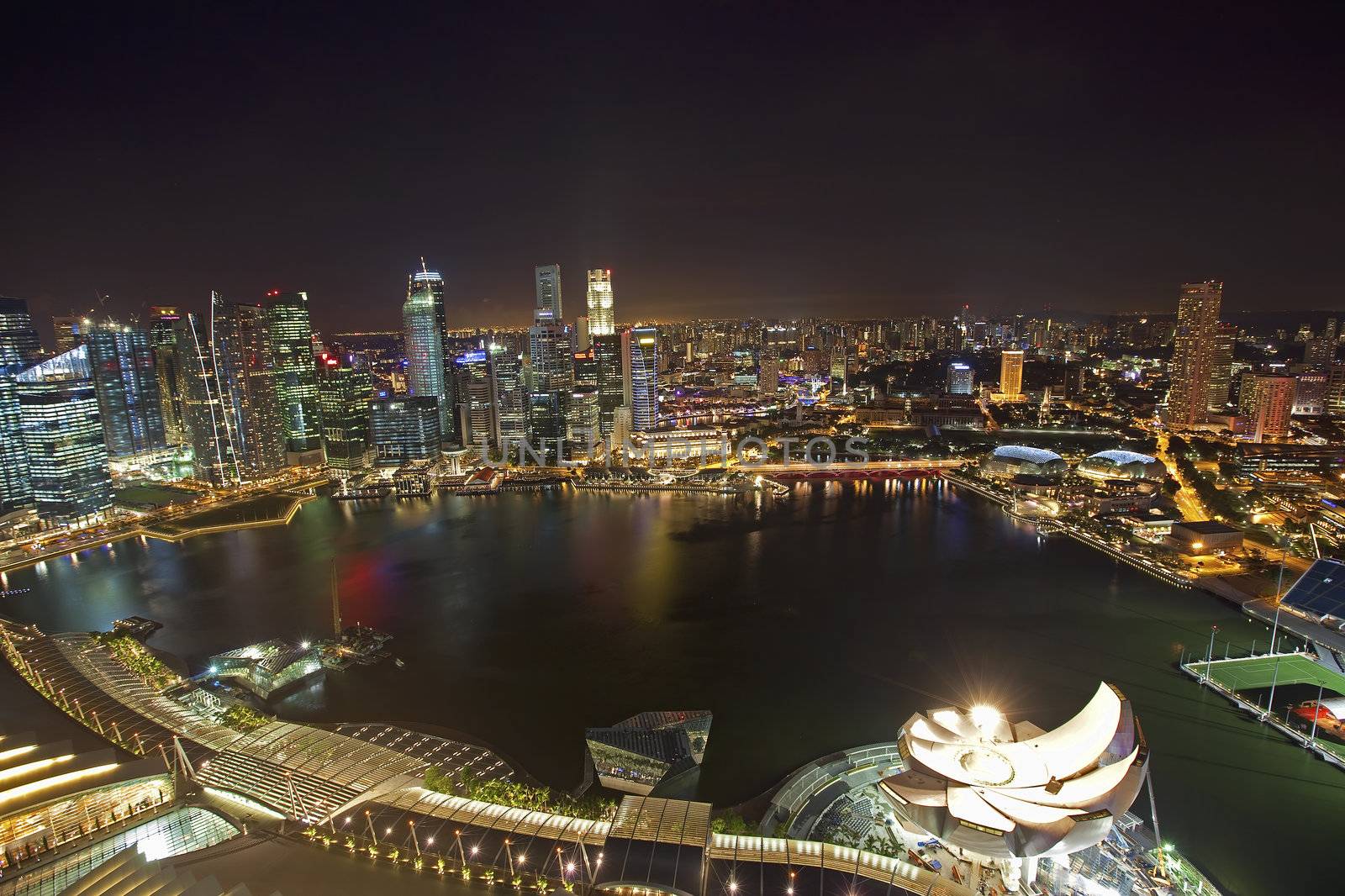 Night scene of financial district, Singapore From the river