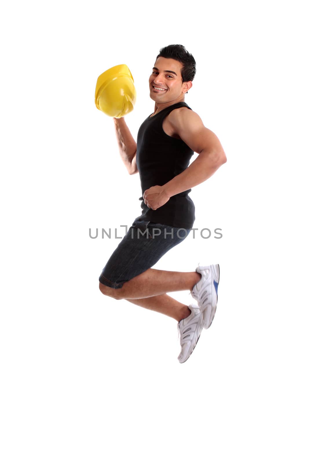 A male construction worker, builder or other tradesman jumping into the air.  White background.