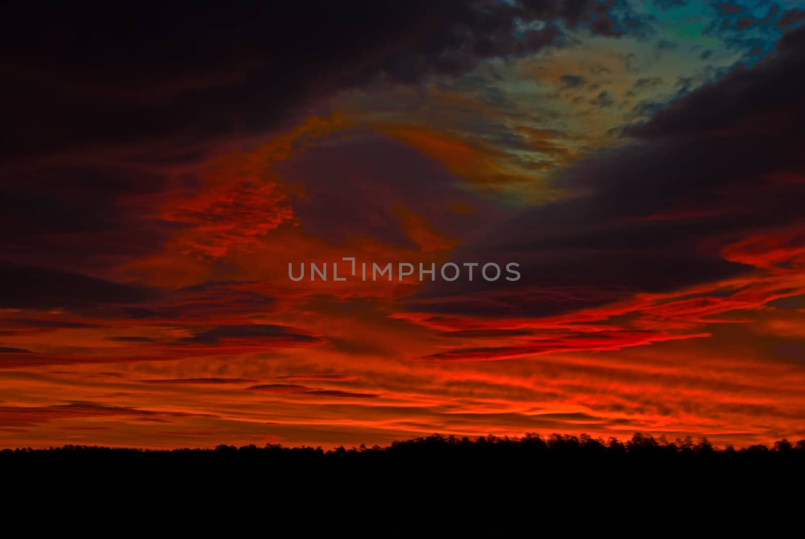 the dark red sunrise background with clouds