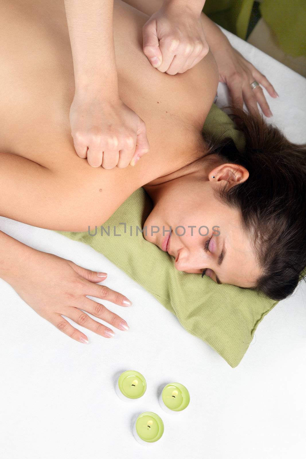 A young woman receives a massage.  by Farina6000